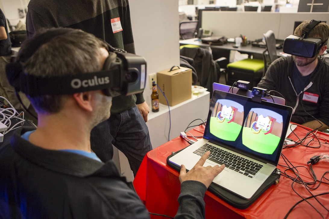 Professionals in an office using VR headsets to test and develop immersive virtual applications for the workplace.
