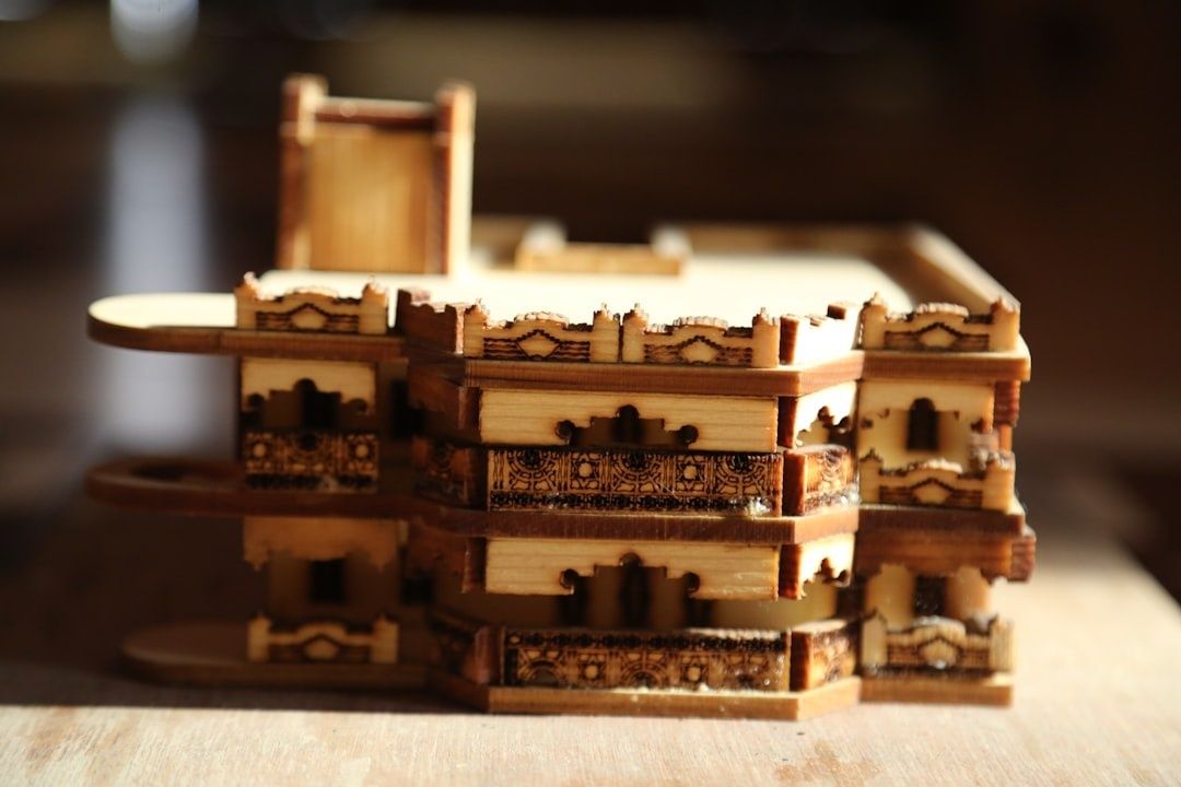 Intricately carved wooden mechanical puzzle box with layered sections