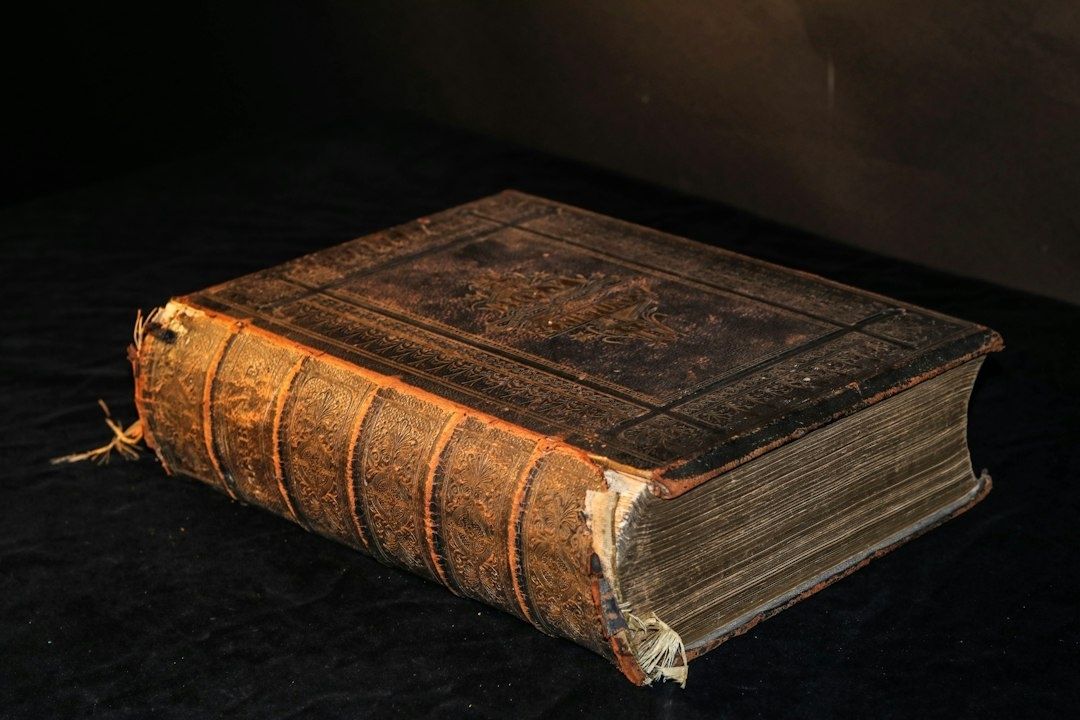 Worn, ornate leather-bound book suggesting gothic horror literature