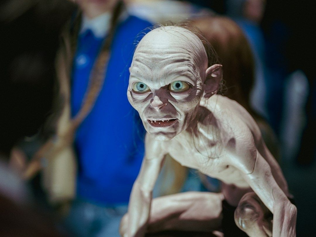 Close-up of a pale, wide-eyed humanoid creature puppet